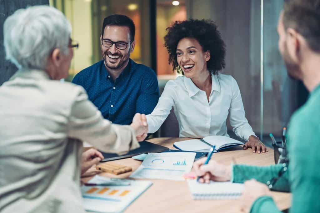 Businesswomen shaking hands in the office